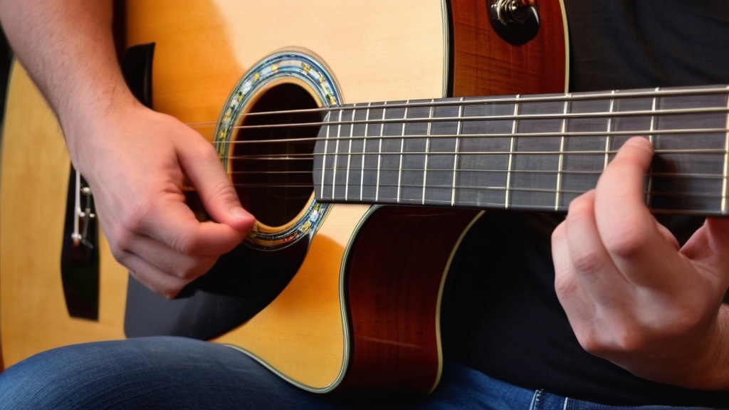 Photo guitar playing for left-handers
